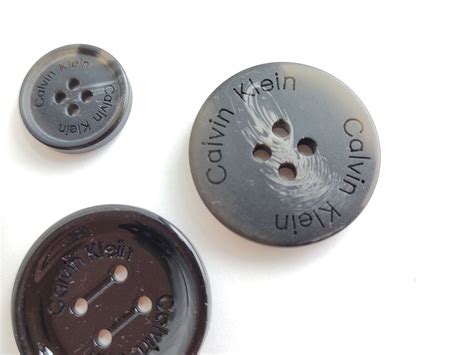 fake calvin kleins|Calvin Klein coat button replacement.